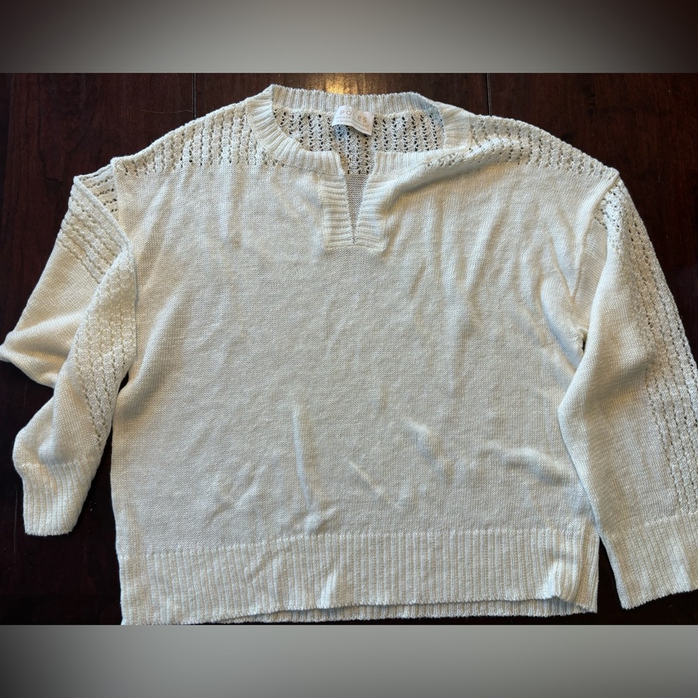 Poles by Madison Montagut white linen sweater.